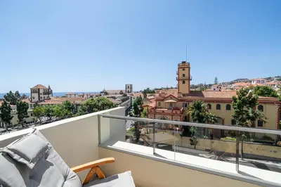 a balcony with a view of a city at Atlantic Blue 1 - central and with garage in Funchal