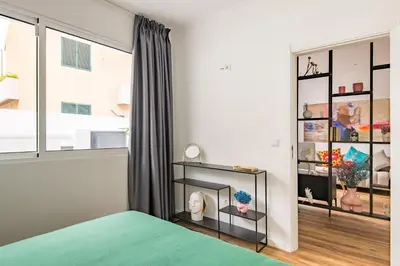 a bedroom with a bed and a window at Eva Boutique Apartment in Funchal