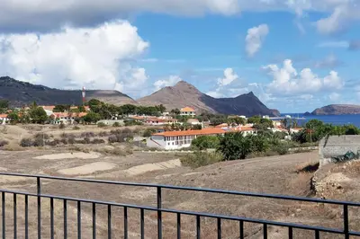a view of a town with mountains in the background at Oásis by BCA Villas in Porto Santo