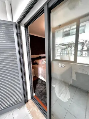 a sliding glass door of a room with a bedroom at Funchal Lido View 1 in Funchal