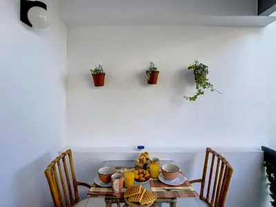 a table with a plate of fruit on top of it at Casa Pico dos Barcelos by LovelyStay in Funchal