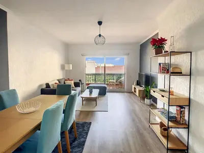 a living room with a table and a living room with a couch at Casa Pico dos Barcelos by LovelyStay in Funchal