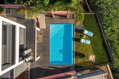 an overhead view of a swimming pool in a house at Villa Candelária by An Island Apart in Ribeira Brava