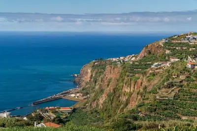 a village on a mountain next to the ocean at Villa Candelária by An Island Apart in Ribeira Brava