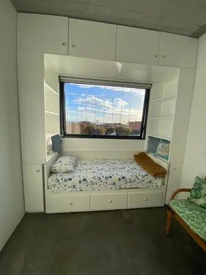 a small room with a bed and a window at CASA DA PITANGA in Jardim do Mar
