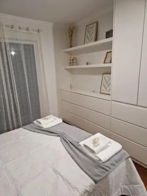 a bedroom with a bed with two towels on it at Cristinas 2 Bedroom Apartment Caniço in Caniço