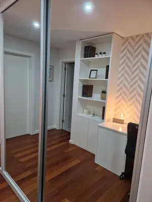 a mirror in a room with a desk and a door at Cristinas 2 Bedroom Apartment Caniço in Caniço