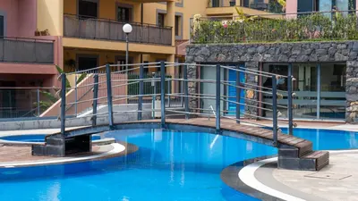 a swimming pool in the middle of a building at Deluxe Living by LovelyStay in Funchal