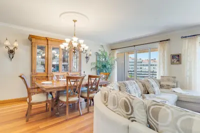a living room with a couch and a table and chairs at Monumental Ocean View by Atlantic Holiday in Funchal