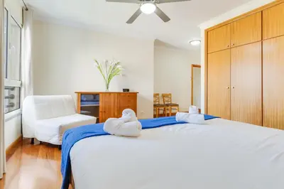 a bedroom with a large bed with towels on it at Monumental Ocean View by Atlantic Holiday in Funchal