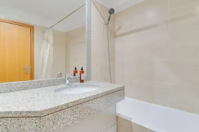 a bathroom with a sink and a mirror at Monumental Ocean View by Atlantic Holiday in Funchal