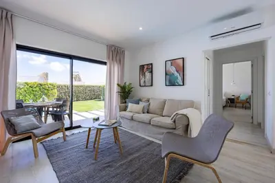 a living room with a couch and a table at Villa Back Loop in Sagres