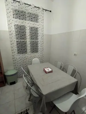 a table and chairs in a room with a table and a table and chairsktop at Bus Stop House 84 in Funchal
