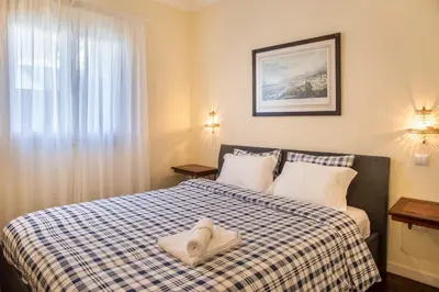 a bedroom with a bed with a pillow on it at Villa Echium T2 in Caniço