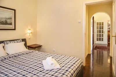 a hotel room with a bed with a towel on it at Villa Echium T2 in Caniço