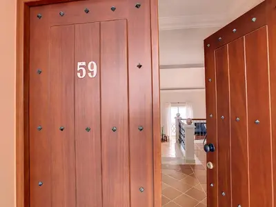 a wooden door with the number on it at Ocean 59 by LovelyStay in Funchal