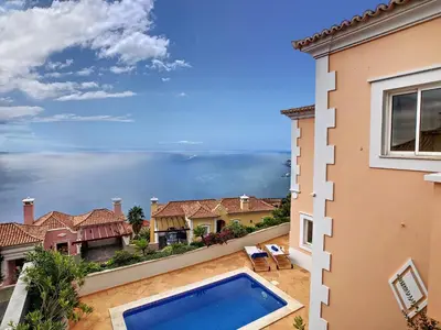 a view from the balcony of a house with a swimming pool at Ocean 59 by LovelyStay in Funchal