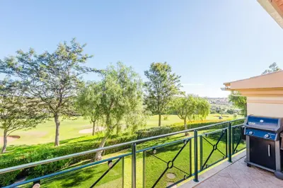 a balcony with a view of a golf course at Fairviews Village - Boavista Resort in Lagos in Lagos