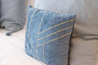 a blue pillow sitting on top of a couch at Porto de Mos 105 by Destination Algarve in Lagos