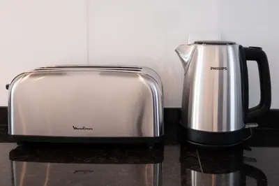 a toaster and coffee pot sitting on a counter at Porto de Mos 105 by Destination Algarve in Lagos
