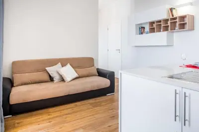 a living room with a couch in a kitchen at Modern and cozy Apartment in Funchal