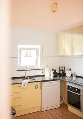 a kitchen with a sink and a counter top at Casa Pedro in Salema - Oceanview & beach in Salema
