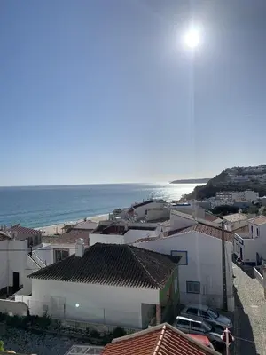 a view of a town with the ocean in the background at Casa Pedro in Salema - Oceanview & beach in Salema