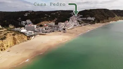 an aerial view of a beach with a city at Casa Pedro in Salema - Oceanview & beach in Salema