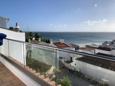 a balcony with a view of the ocean at Casa Pedro in Salema - Oceanview & beach in Salema