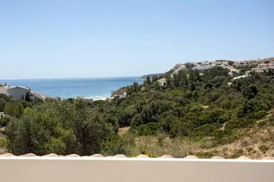 a view of the ocean from a house at 401 Villa Salemar in Salema