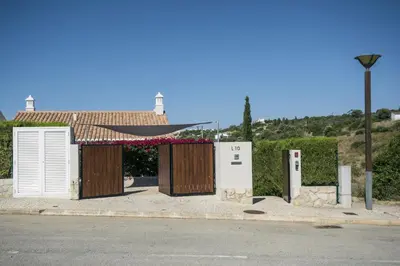 a couple of buildings on the side of a street at 401 Villa Salemar in Salema