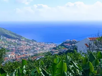 a view of a city from a hill at Sea Mountain House in Machico