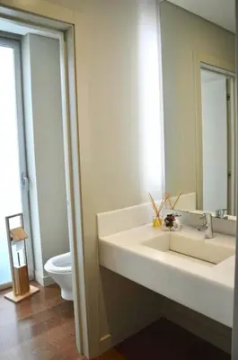 a bathroom with a sink and a toilet and a mirror at Peaceful Madeira Palace in Funchal