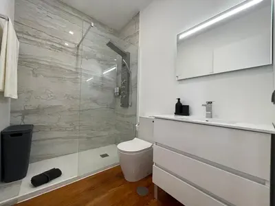 a bathroom with a shower and a toilet and a sink at Sea and Sun 4 You - Villa Oliveira in Funchal