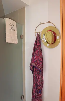 a bedroom with a bed with two pillows at Casa das Rosas e Casa Do Mar in Arco da Calheta