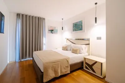 a hotel room with a bed and a window at Magic Home, everything you need. in Funchal