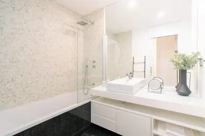 a white bathroom with a sink and a shower at Magic Home, everything you need. in Funchal