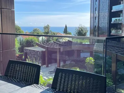 a balcony with two chairs and a table at Magic Home, everything you need. in Funchal