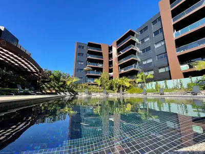 a pool of water in front of some buildings at Magic Home, everything you need. in Funchal
