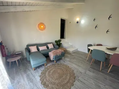 a living room with a couch and a table at Casa da Estrelinha in Carrapateira