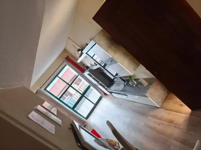 an overhead view of a kitchen with a table and chairs at Slice of Paradise- Palheiro de Golf in Funchal