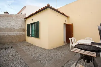 a small car parked in front of a house at Slice of Paradise- Palheiro de Golf in Funchal