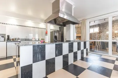 a kitchen with a cutting board with vegetables on a counter at Paradise View by Atlantic Holiday in Funchal