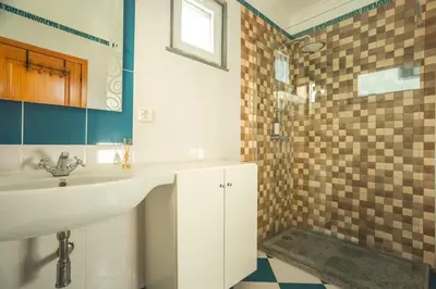 a hallway with glass doors and a stone wall at Paradise View by Atlantic Holiday in Funchal