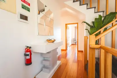 a living room with a fire extinguisher on the wall at Paradise View by Atlantic Holiday in Funchal