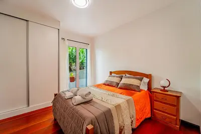 a bedroom with a bed and a window at Casa Dolce Vita in Ponta do Sol