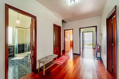 a living room with a bench and a walk in shower at Casa Dolce Vita in Ponta do Sol