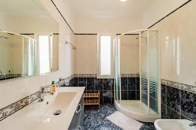 a bathroom with a tub and a sink and a shower at Casa Dolce Vita in Ponta do Sol