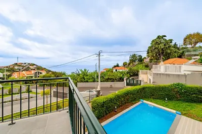 a view from the balcony of a house with a swimming pool at Casa Dolce Vita in Ponta do Sol