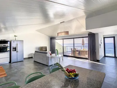 a living room with a couch and a table at On the Wave by LovelyStay in Paul do Mar